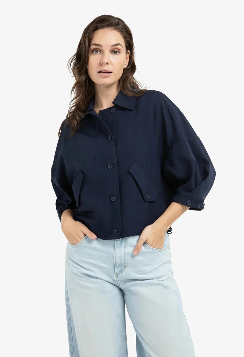 Blouse jacket with adjustable waistband and pockets